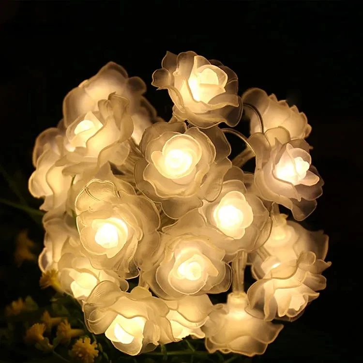 Silicon rose string lights glowing softly with rose petals