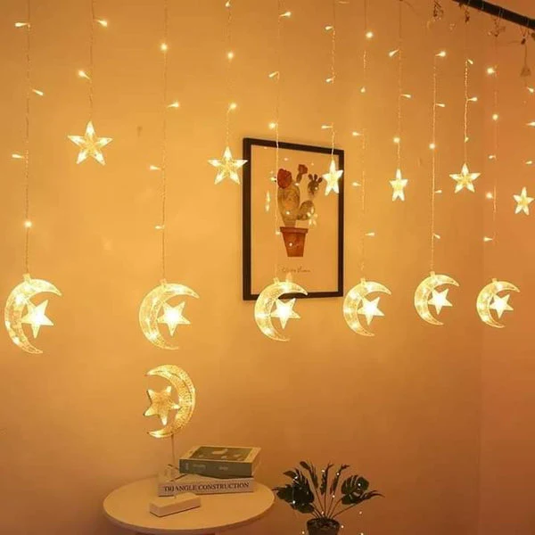 Warm glowing crescent moon curtain lights for home décor